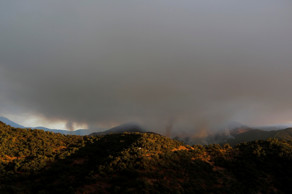 A wildfire burns on Sierra Bermeja mountain, in Genalguacil, near Estepona, Spain, September 11, 2021. REUTERS/Jon Nazca