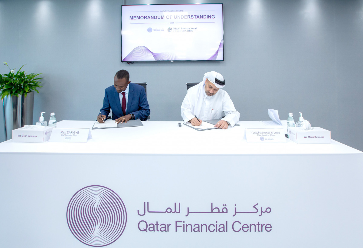 QFC Chief Executive Officer, Yousuf Mohamed Al Jaida, and RFL Chief Executive Officer, Nick Barigye, signing the agreement.