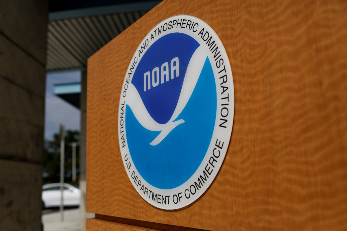 FILE PHOTO: The logo of the National Oceanic and Atmospheric Administration is seen at the National Hurricane Center in Miami, Florida, U.S. August 29, 2019. REUTERS/Marco Bello/File Photo
