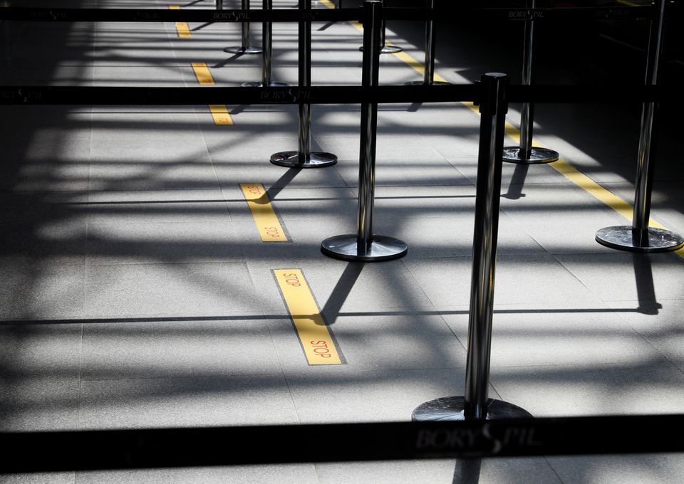 Social distancing markings are seen on the floor at the Boryspil International Airport outside Kiev, Ukraine June 13, 2020. REUTERS/Gleb Garanich

