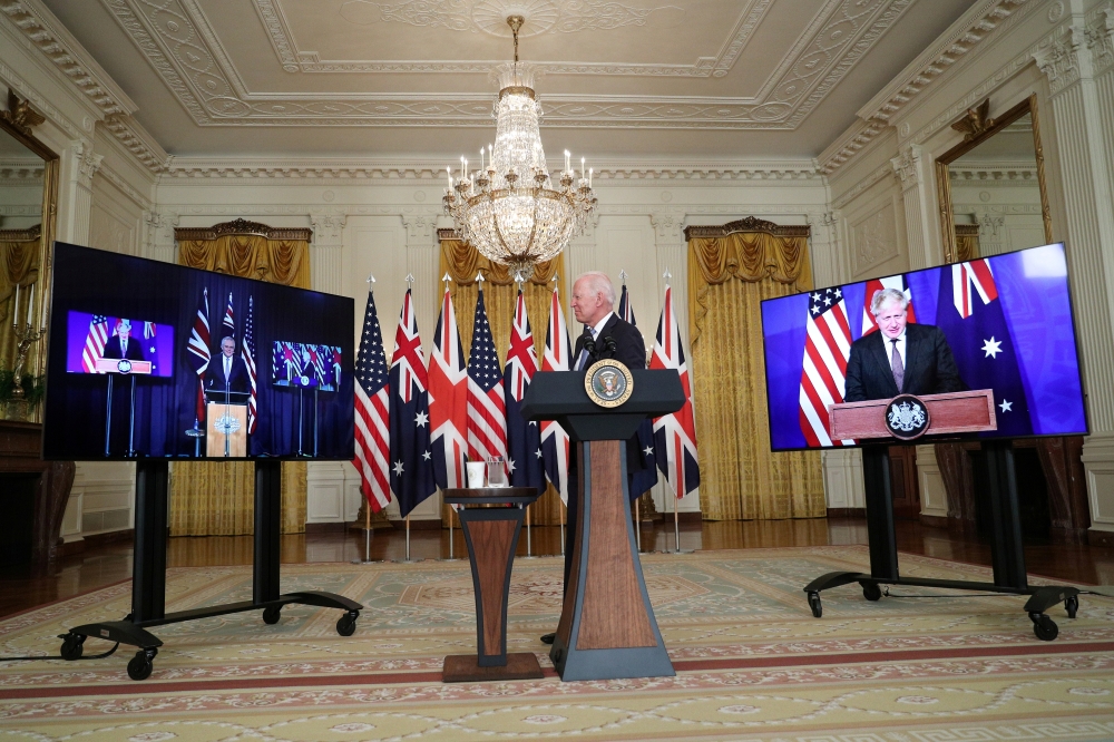 US President Joe Biden delivers remarks on a National Security Initiative virtually with Australian Prime Minister Scott Morrison and British Prime Minister Boris Johnson, inside the East Room at the White House in Washington, U.S., September 15, 2021. Re