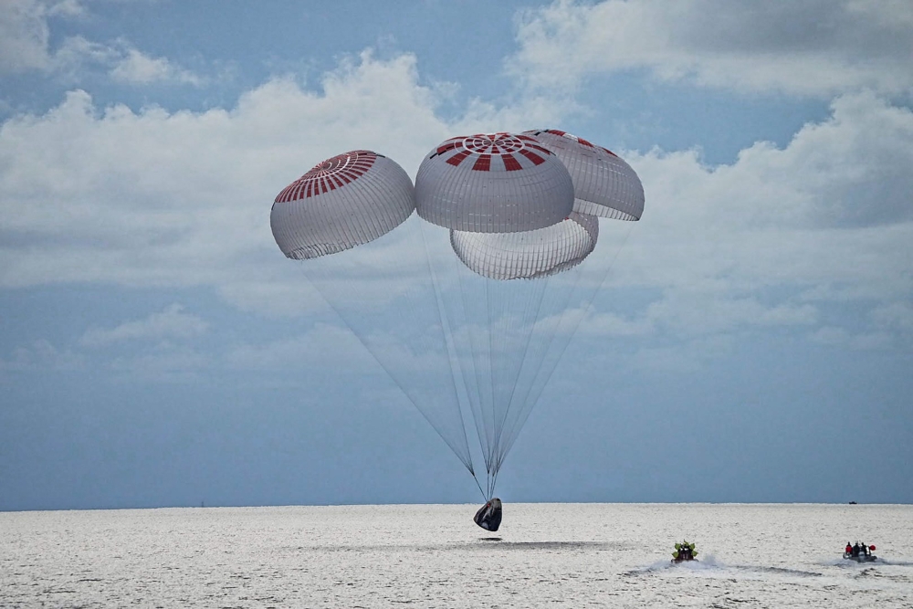 The quartet of newly minted citizen astronauts comprising the SpaceX Inspiration4 mission safely splashes down in SpaceX's Crew Dragon capsule off the coast of Kennedy Space Center, Florida, U.S. September 18, 2021. SpaceX/Handout via REUTERS