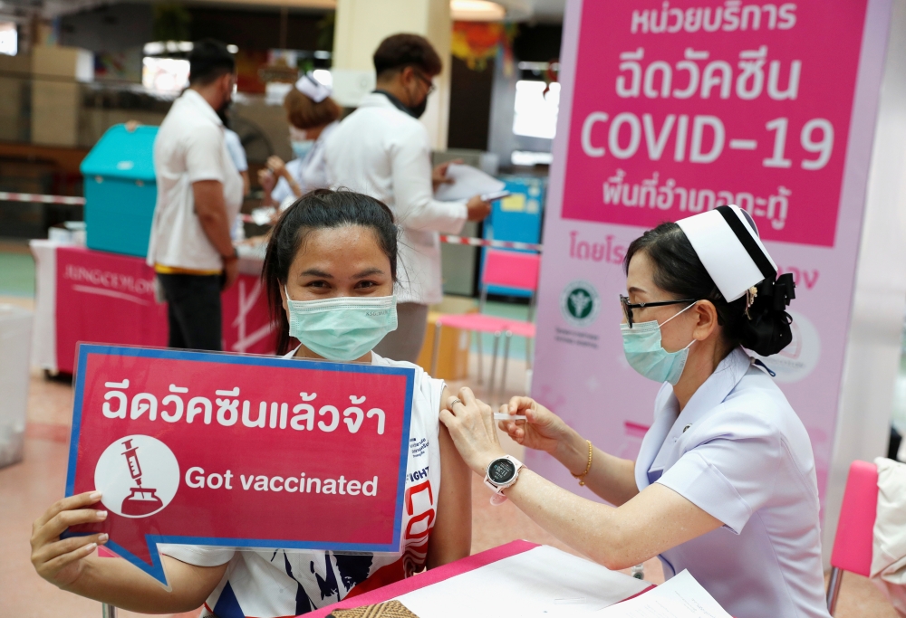 People receive the Sinovac COVID-19 vaccine as the Thai resort island of Phuket rushes to vaccinate its population amid the coronavirus disease (COVID-19) outbreak, and ahead of a July 1 ending of strict quarantine for overseas visitors, to bring back tou