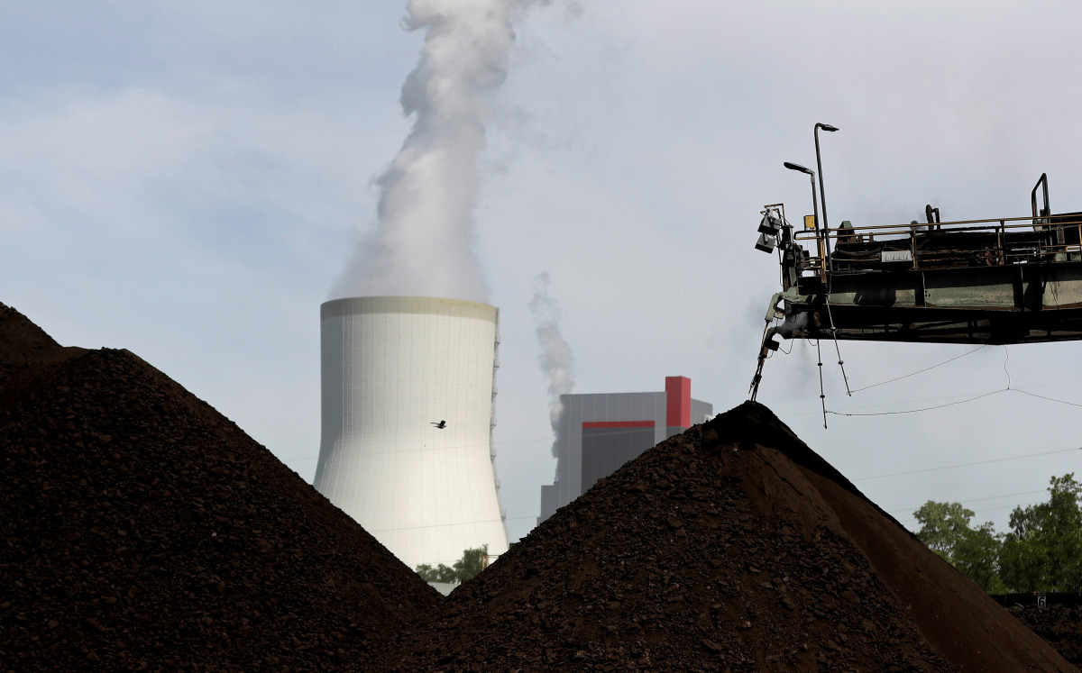 FILE PHOTO: A cooling tower from the Turow coal-fired power plant is seen near the Turow open-pit coal mine operated by the company PGE in Bogatynia, Poland, June 15, 2021. Picture taken June 15, 2021. REUTERS/David W Cerny/File Photo
