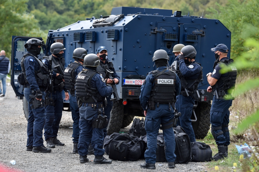 Kosovo special police with armoured vehicles are pictured as hundreds of Kosovo Serbs protest against a government ban on entry of vehicles with Serbian registration plates in Jarinje, Kosovo, September 21, 2021. REUTERS/Laura Hasani