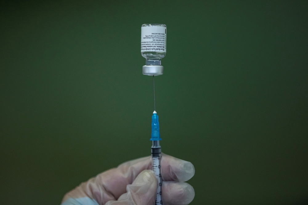 File photo: A medical worker fills a syringe with Pfizer-BioNTech vaccine at the Covid-19 vaccination centre of 'Healthcare Centre' in Nis, Serbia, March 3, 2021. Reuters/Marko Djurica/File Photo