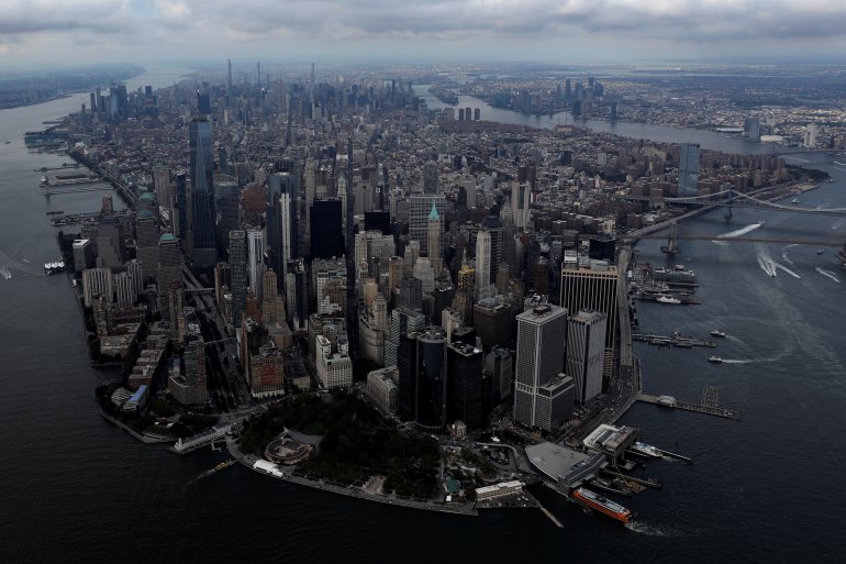 FILE PHOTO: Clouds form over Manhattan ahead of Hurricane Henri arriving in New York City, U.S., August 21, 2021. REUTERS/Andrew Kelly
