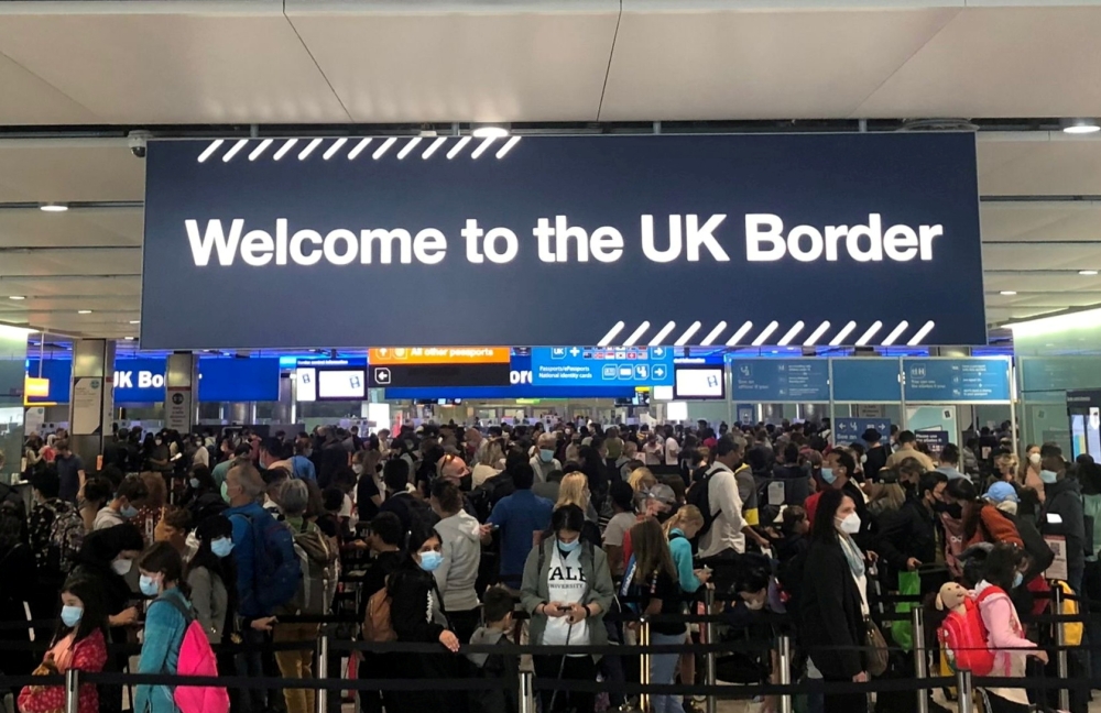 Queues of people wait in line at U.K. citizens arrivals at Heathrow Airport in London, Britain, September 1, 2021. REUTERS/Guy Faulconbridge/File Photo