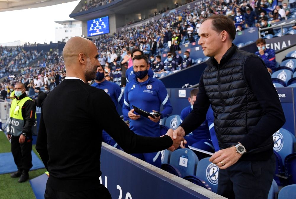 May 29, 2021 Manchester City manager Pep Guardiola with Chelsea manager Thomas Tuchel before the match Pool via REUTERS/Pierre-Philippe Marcou/File Photo