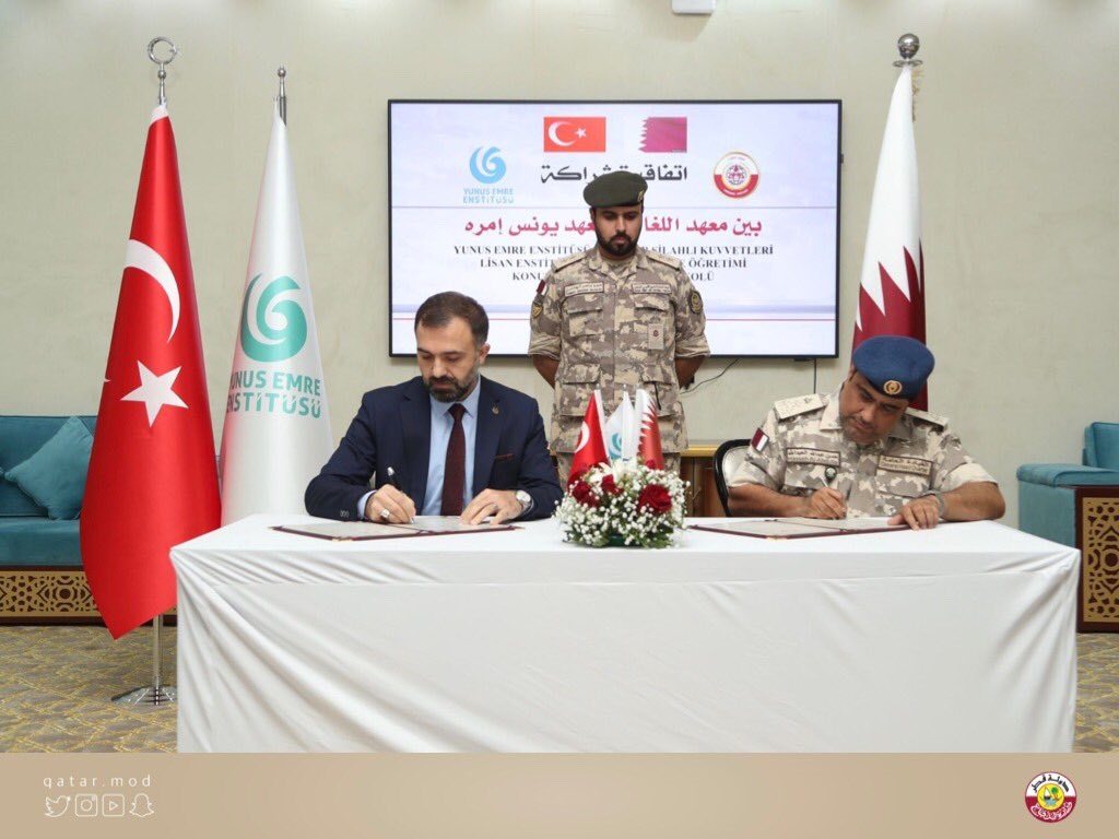 Director of the Languages Institute, Brigadier General (Pilot) Hassan Abdullah Ahmed Al Abdullah, and Director of Yunus Emre Turkish Cultural Center in Doha, Dr. Selcuk Kursad Koca signing the agreement.