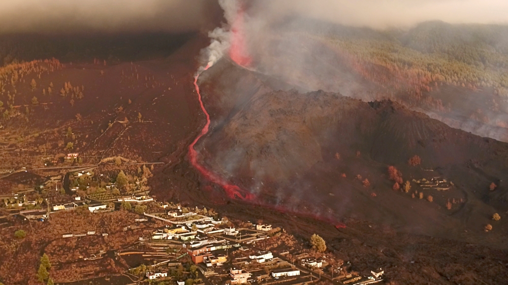 A screengrab from drone footage shows lava flowing following the eruption of a volcano in the Cumbre Vieja park, on the Canary Island of La Palma, Spain September 26, 2021. REUTERS TV via REUTERS