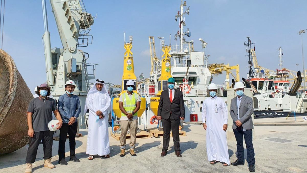 Officials from MME and Mwani Qatar during a visit to an air quality monitoring station at Hamad Port.