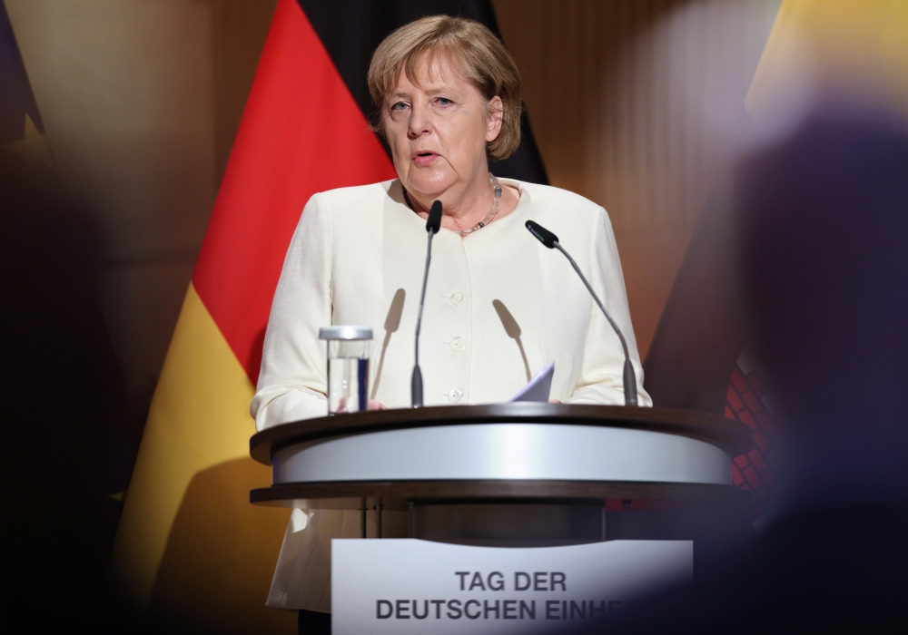 Outgoing German Chancellor Angela Merkel speaks at a ceremony to mark the 31st anniversary of Germany's Unification Day, in the city of Halle, Germany, October 3, 2021. Jan Woitas/Pool via REUTERS