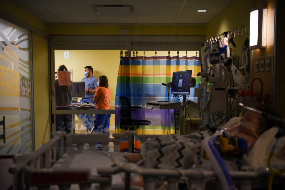Doctors discuss the treatment of Adrian James, 2, who tested positive for the coronavirus disease (COVID-19), at SSM Health Cardinal Glennon Children's Hospital in St. Louis, Missouri, U.S., October 5, 2021. Reuters/Callaghan O'Hare