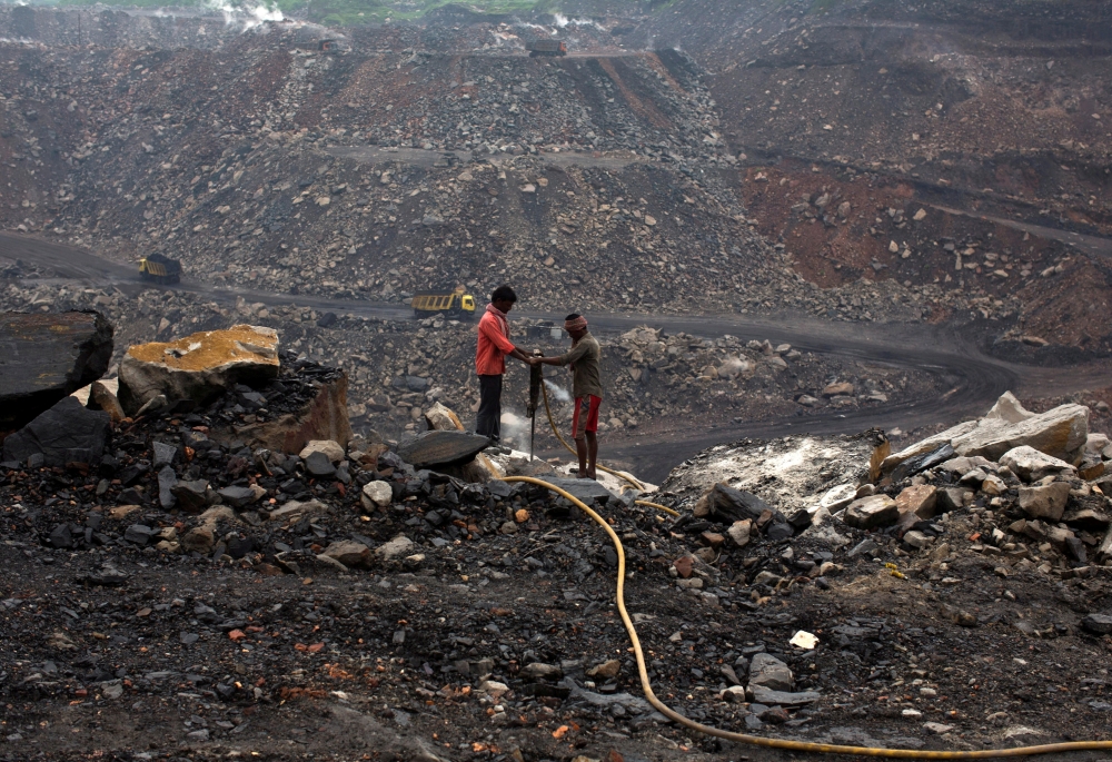 File photo: Workers drill at an open cast coal field at Dhanbad district in the eastern Indian state of Jharkhand September 18, 2012. Reuters/Ahmad Masood/File Photo