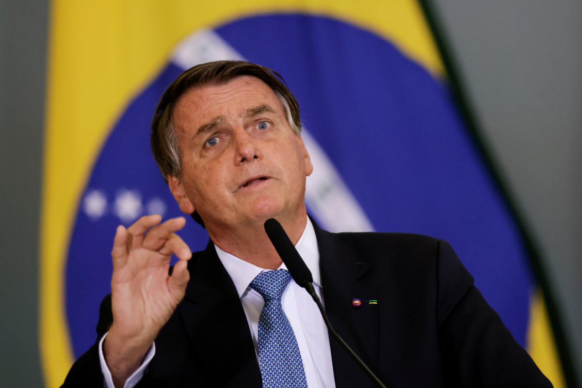 FILE PHOTO: Brazil's President Jair Bolsonaro gestures during the ceremony for the Modernization of Occupational Health and Safety Regulations, at the Planalto Palace in Brasilia, Brazil October 7, 2021. REUTERS/Ueslei Marcelino/File Photo
