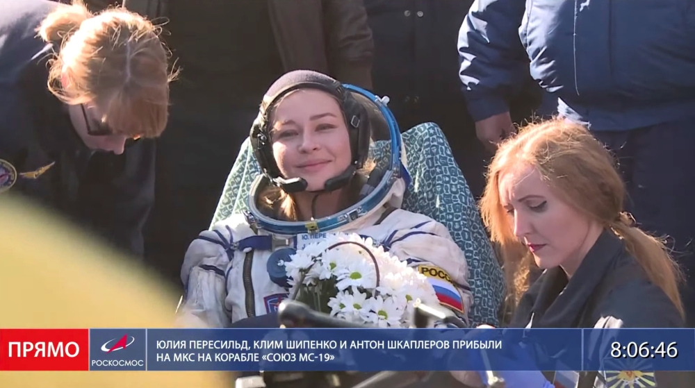 The International Space Station (ISS) crew member Russian actress Yulia Peresild rests after the landing of the Soyuz MS-18 space capsule in a remote area outside Zhezkazgan, Kazakhstan October 17, 2021, in this still image taken from video. Roscosmos/Han