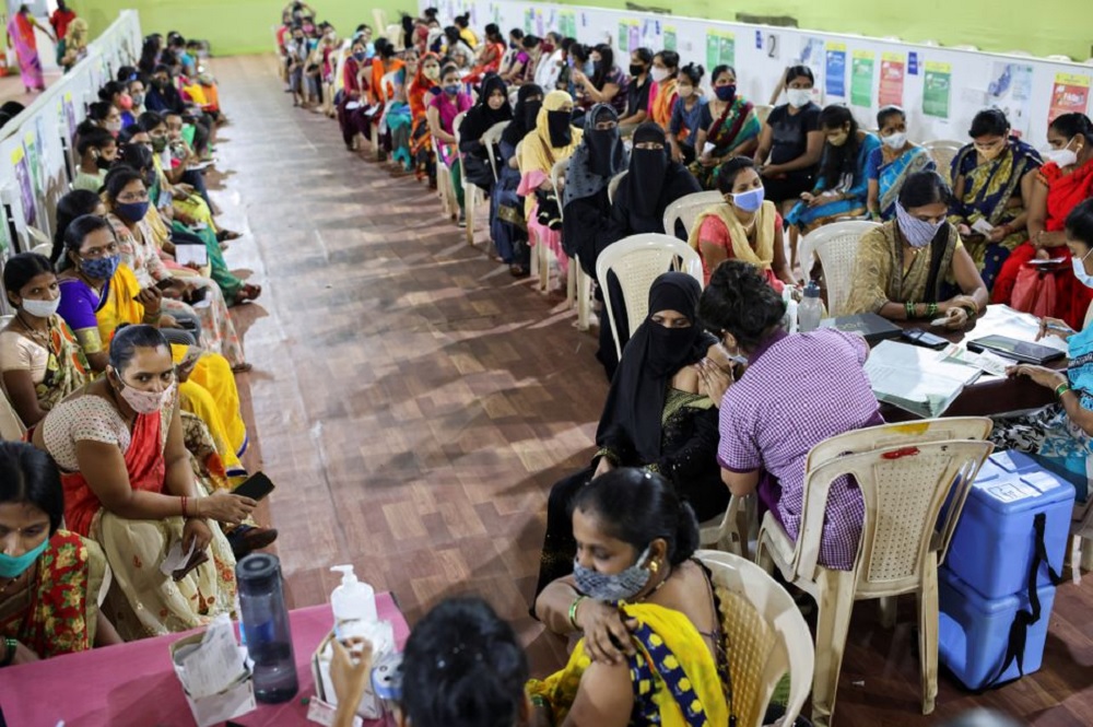 A woman receives a dose of AstraZeneca's COVISHIELD vaccine, produced by the Serum Institute of India, during a special coronavirus disease (COVID-19) vaccination campaign for women at a medical centre in Mumbai, India, September 27, 2021. REUTERS/Francis