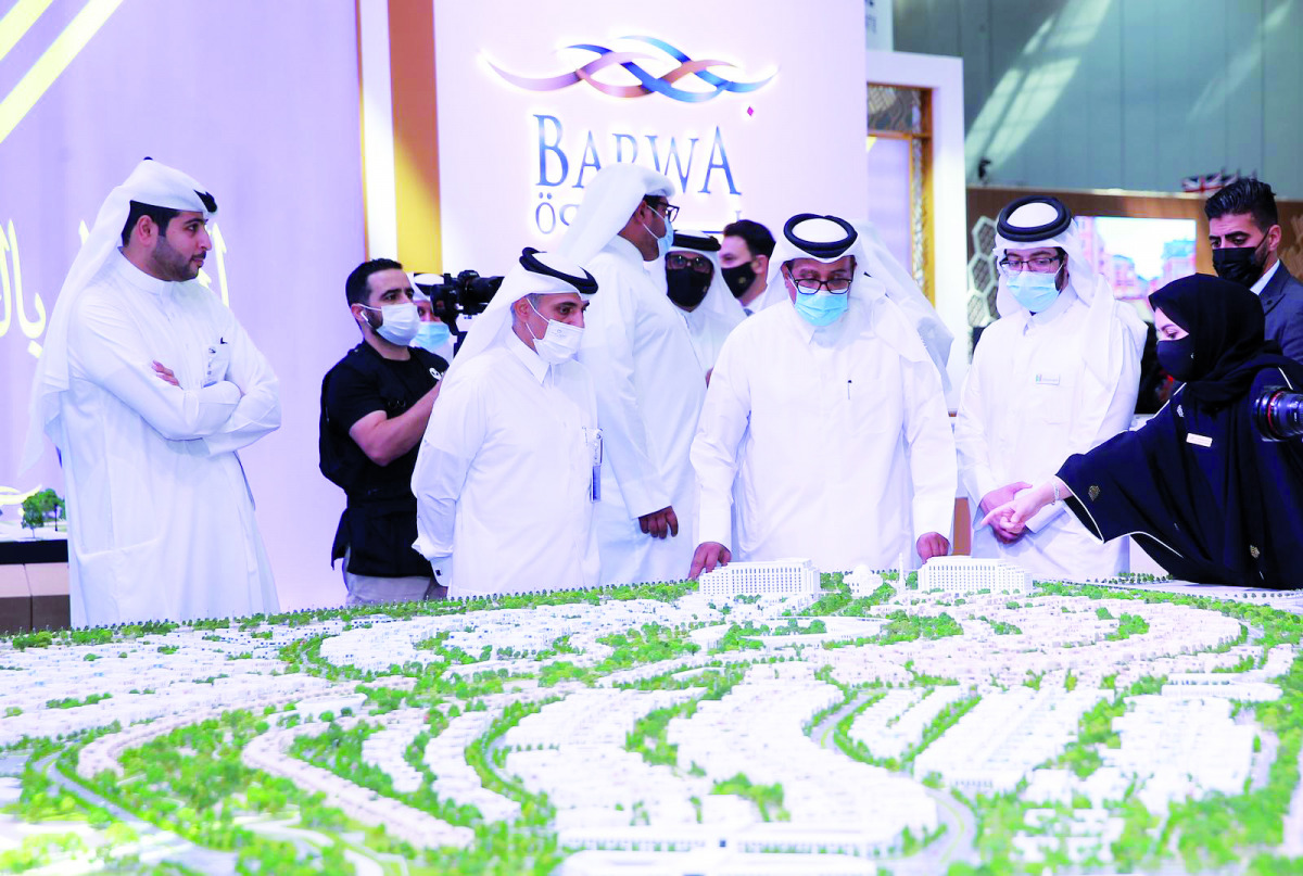 Abdullah bin Jubara Al Rumaihi (second left), CEO of Barwa Real Estate Group, with other officials, at Barwa's pavilion, during Cityscape Qatar 2021. 