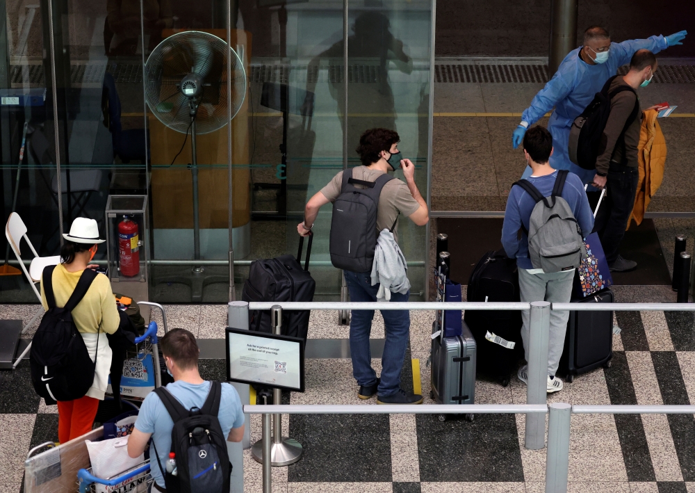 Passengers from Amsterdam arrive at Changi Airport under Singapore’s expanded Vaccinated Travel Lane (VTL) quarantine-free travel scheme, as the city-state opens its borders to more countries amidst the coronavirus disease (COVID-19) pandemic, in Singapor