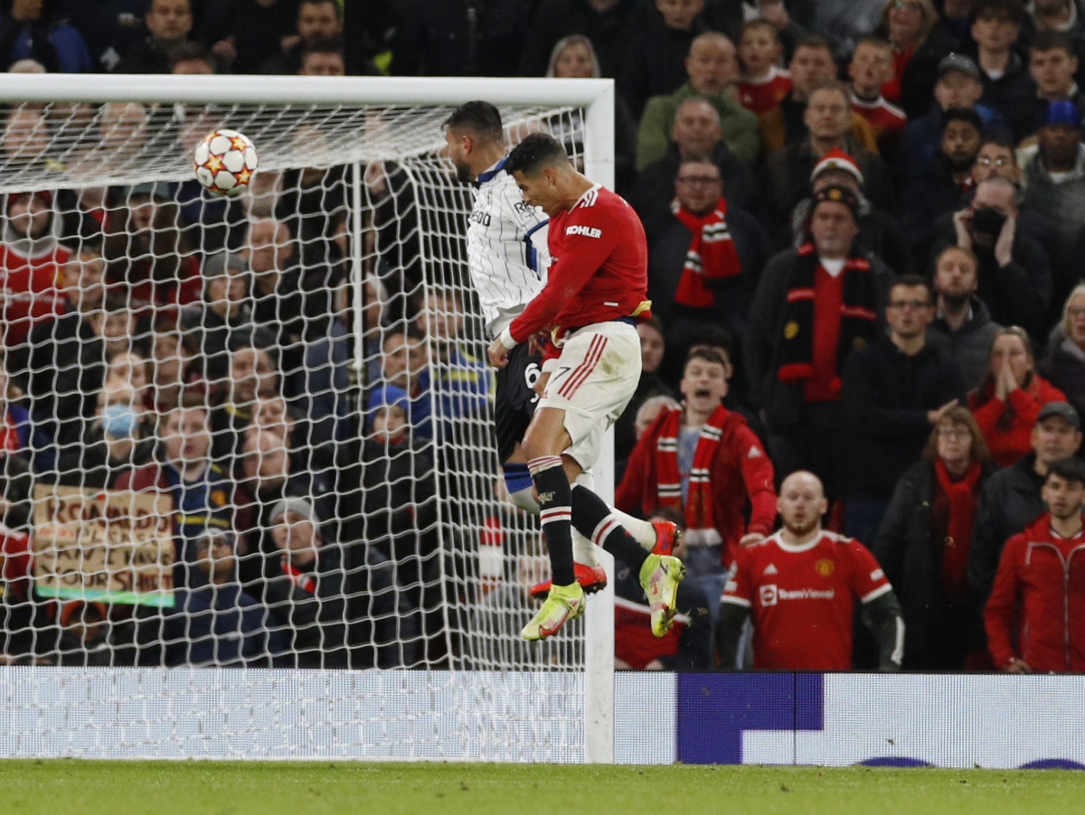 Manchester United's Cristiano Ronaldo scores their third goal REUTERS/Phil Noble
