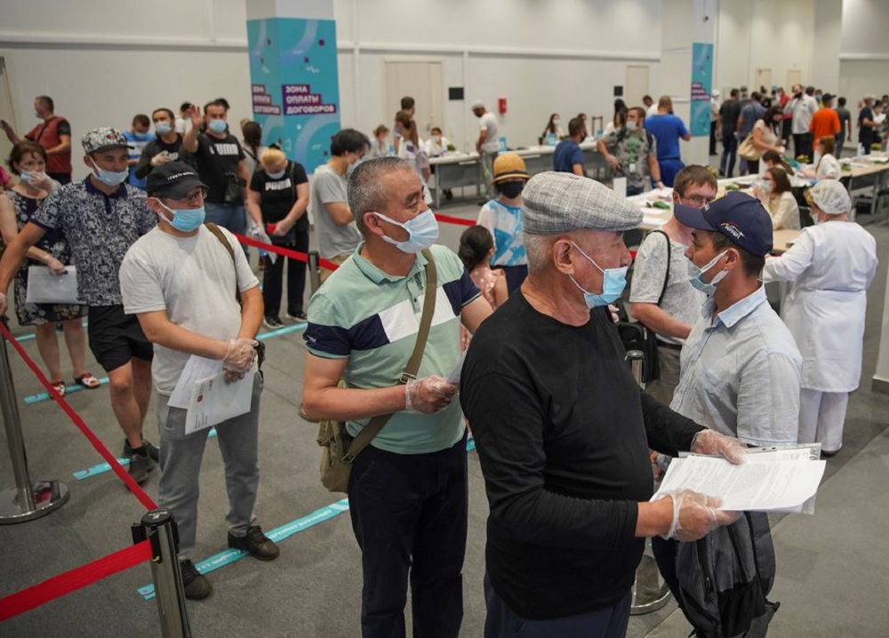 People wait to receive a vaccine against the coronavirus disease (COVID-19) at a vaccination centre in Luzhniki Stadium in Moscow, Russia July 8, 2021. REUTERS/Tatyana Makeyeva