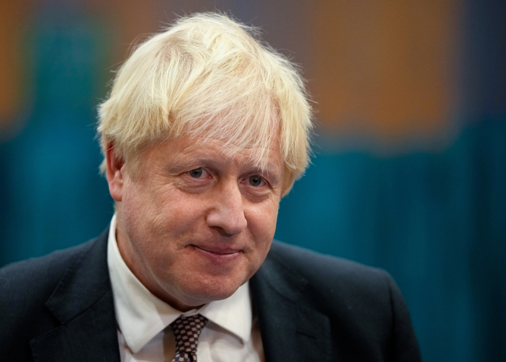 Britain's Prime Minister Boris Johnson speaks to the media as he visits at a COVID-19 vaccination centre at Little Venice Sports Centre, in London, Britain October 22, 2021. Matt Dunham/Pool via REUTERS