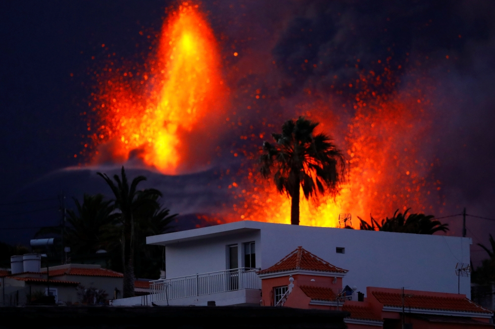 The Cumbre Vieja volcano continues to erupt, as seen from El Paso, on the Canary Island of La Palma, Spain, October 25, 2021. REUTERS/Borja Suarez