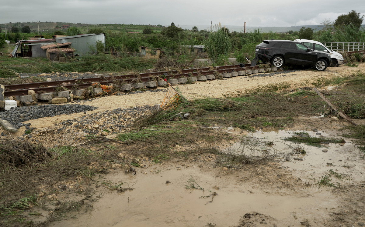 Damaged cars and debris are seen after heavy rain caused flooding in Scordia, near Catania, Italy, October 25, 2021. REUTERS/Antonio Parrinello
