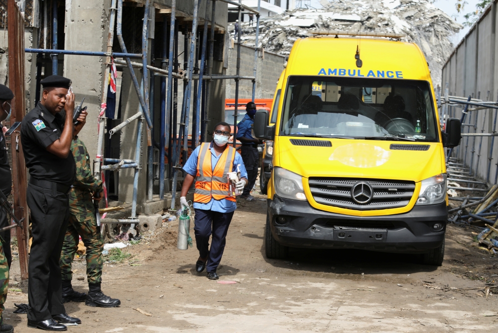 Rescue personnel work near a collapsed building in Ikoyi, Lagos, Nigeria, November 2, 2021. REUTERS/Temilade Adelaja
