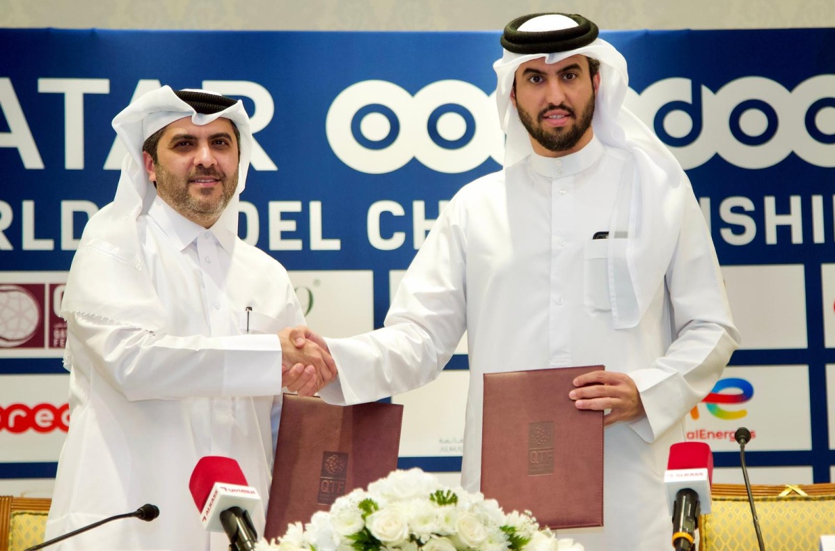 QTSBF Secretary General Tariq Zainal and Executive Director Business Ooredoo Qatar Thani Al Malki shake hands after the signing ceremony yesterday.   