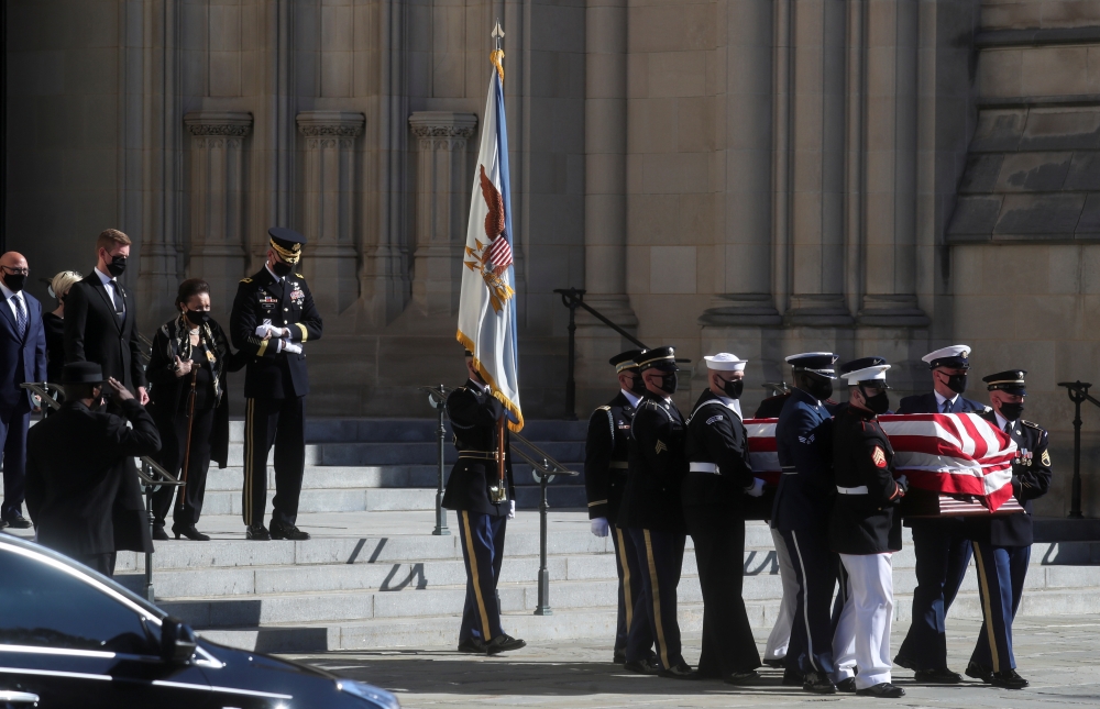Alma Powell, wife of late former U.S. Secretary of State Colin Powell, walks behind his casket as it is carried out after the memorial service at Washington National Cathedral in Washington, DC, U.S. November 5, 2021. REUTERS/Leah Millis