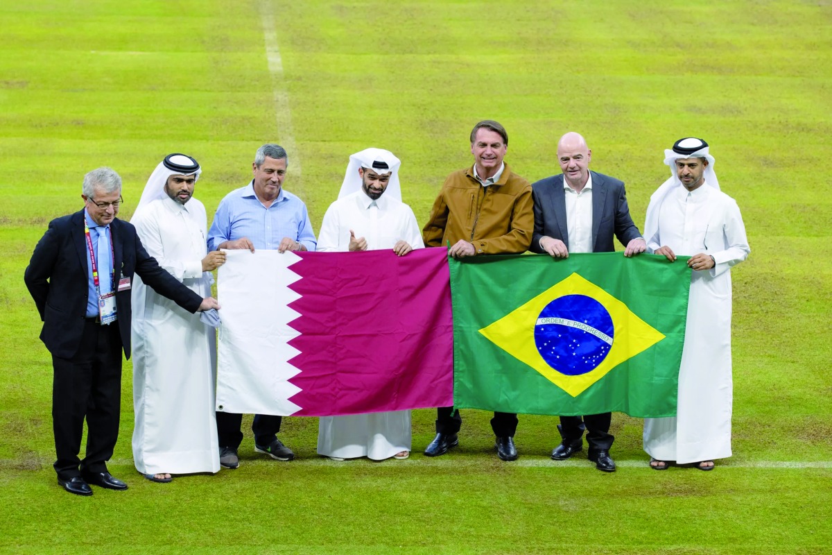 President of Brazil H E Jair Bolsonaro, FIFA President Gianni Infantino, Secretary-General of Supreme Committee for Delivery & Legacy Hassan Al Thawadi, CEO of the FIFA World Cup Qatar 2022 Nasser Al Khater and other top officials pose for a photograph at the Lusail Stadium