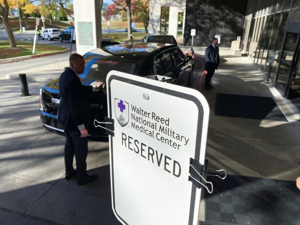 U.S. President Joe Biden's motorcade waits at the curb as he has his annual physical at Walter Reed National Military Medical Center in Bethesda, Maryland, U.S. November 19, 2021. REUTERS/Jonathan Ernst