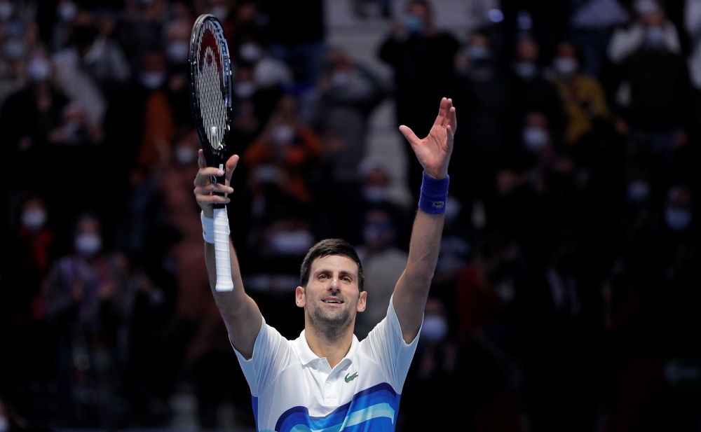 Serbia's Novak Djokovic celebrates after winning his group stage match against Britain's Cameron Norrie Reuters/Guglielmo Mangiapane 
