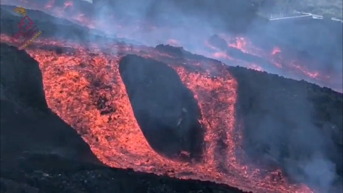 A flow of lava is observed near la Laguna mountain on the Canary island of La Palma, Spain November 22, 2021 in this screen grab obtained from a social media video. Involcan/via REUTERS