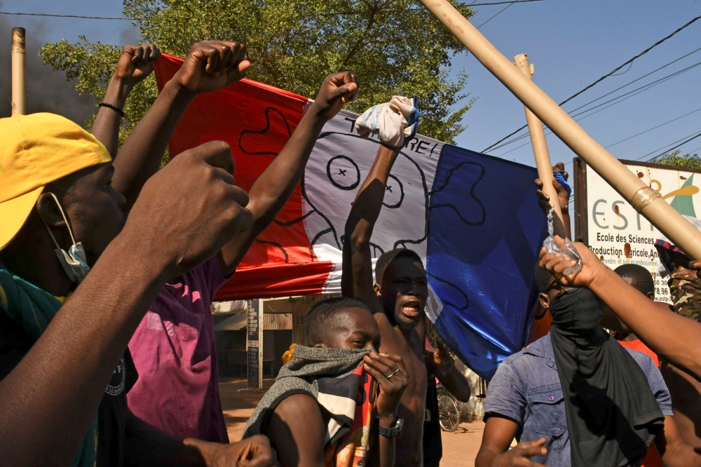 Civil organisations hold a protest calling for Burkina Faso's President Roch Kabore to resign and for the departure of French forces that patrol the country, in Ouagadougou, Burkina Faso, November 27, 2021. REUTERS/Anne Mimault