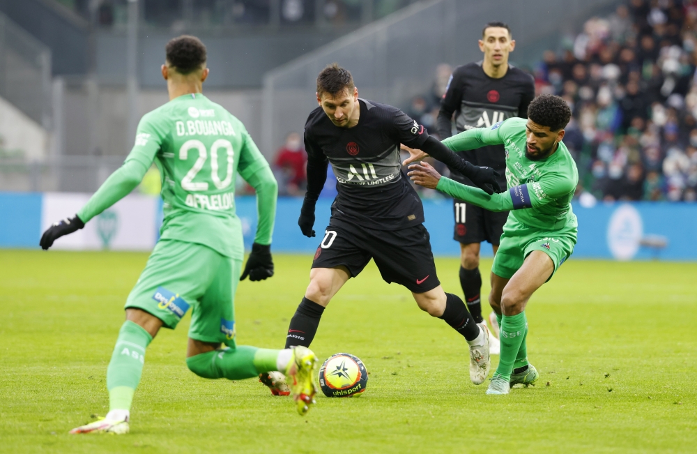 November 28, 2021 Paris St Germain's Lionel Messi in action with AS Saint-Etienne's Mahdi Camara REUTERS/Eric Gaillard