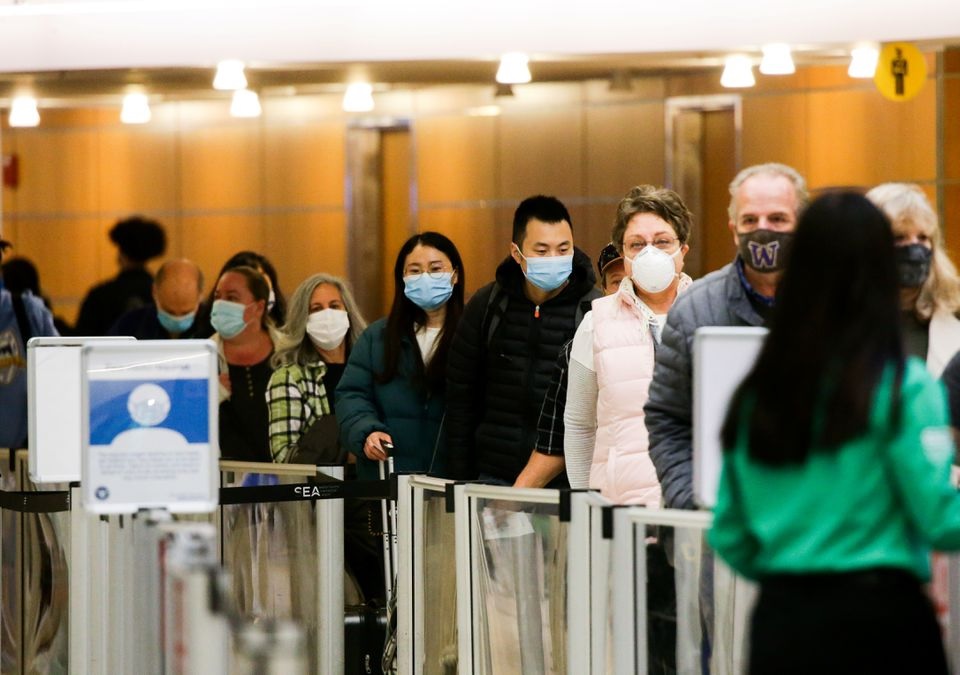 People wait in a general screening line at a security checkpoint at Seattle-Tacoma International Airport before the Thanksgiving holiday in Seattle, Washington, U.S. November 24, 2021. REUTERS/Lindsey Wasson