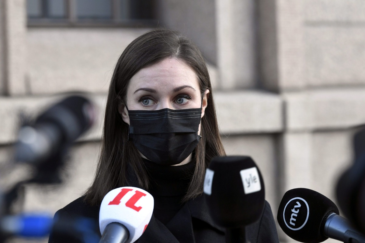 Finnish Prime Minister Sanna Marin holds a news conference outside the Finnish Parliament building in Helsinki, Finland December 8, 2021. Markku Ulander/Lehtikuva/via REUTERS