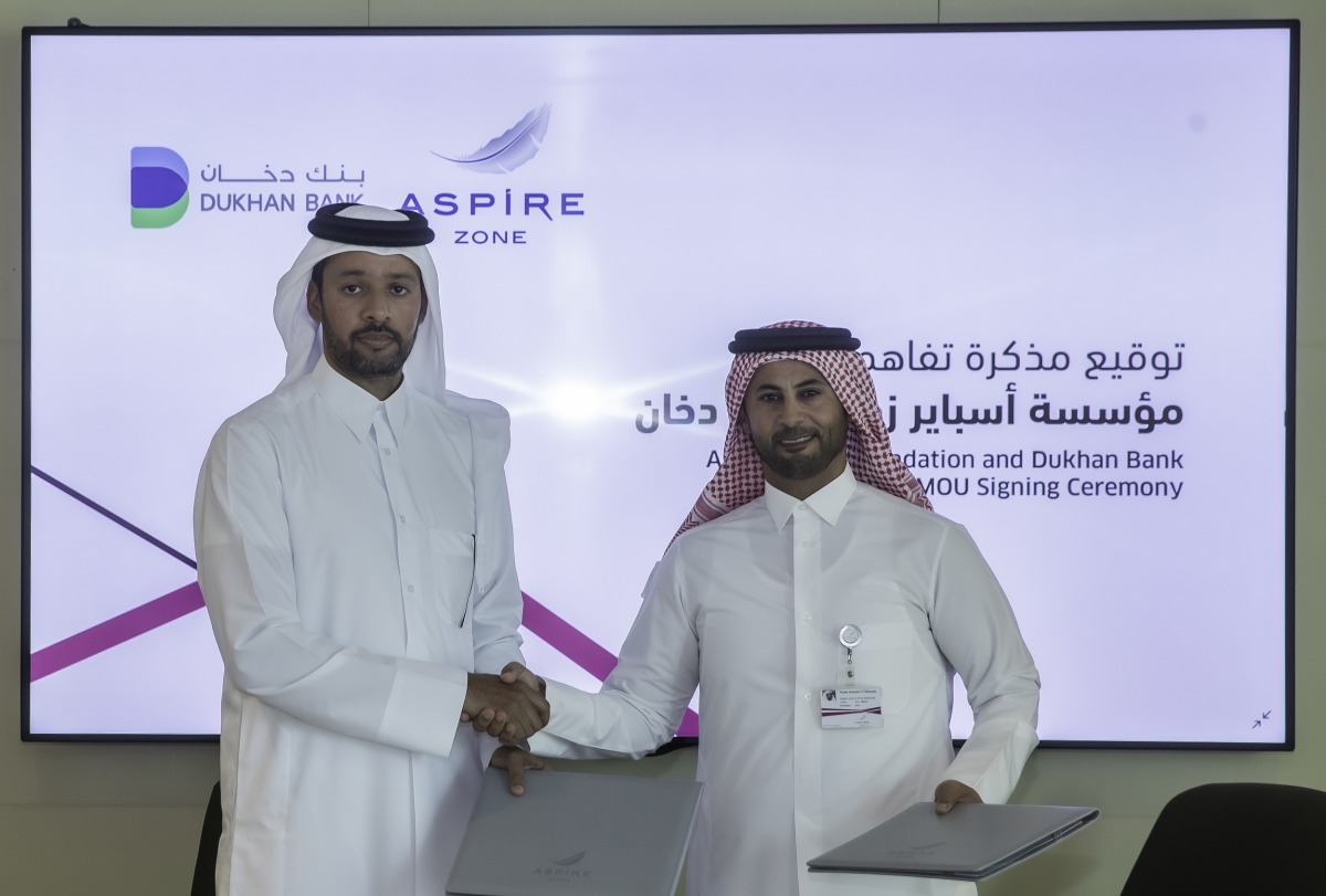 Aspire Zone Foundation Mohammed Khalifa Al Suwaidi and CEO of Dukhan Bank, Khalid Yousef Al Subeai exchanging document after signing the agreement.