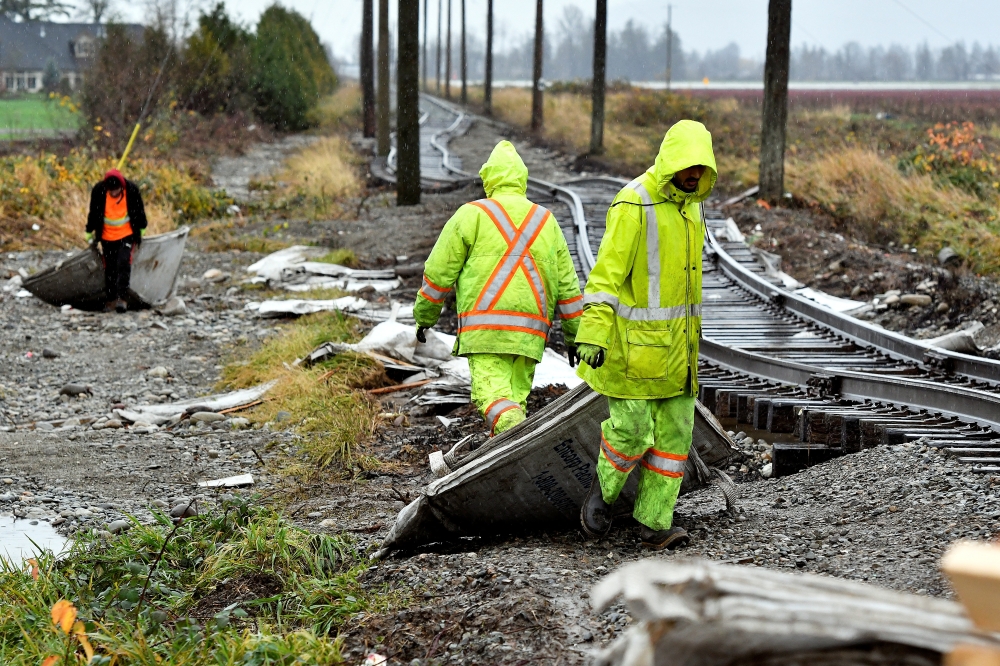Cleanup crews remove debris after rainstorms lashed the western Canadian province, triggering landslides and floods, shutting highways, in Abbotsford, British Columbia, Canada November 30, 2021. REUTERS/Jennifer Gauthier/File Photo