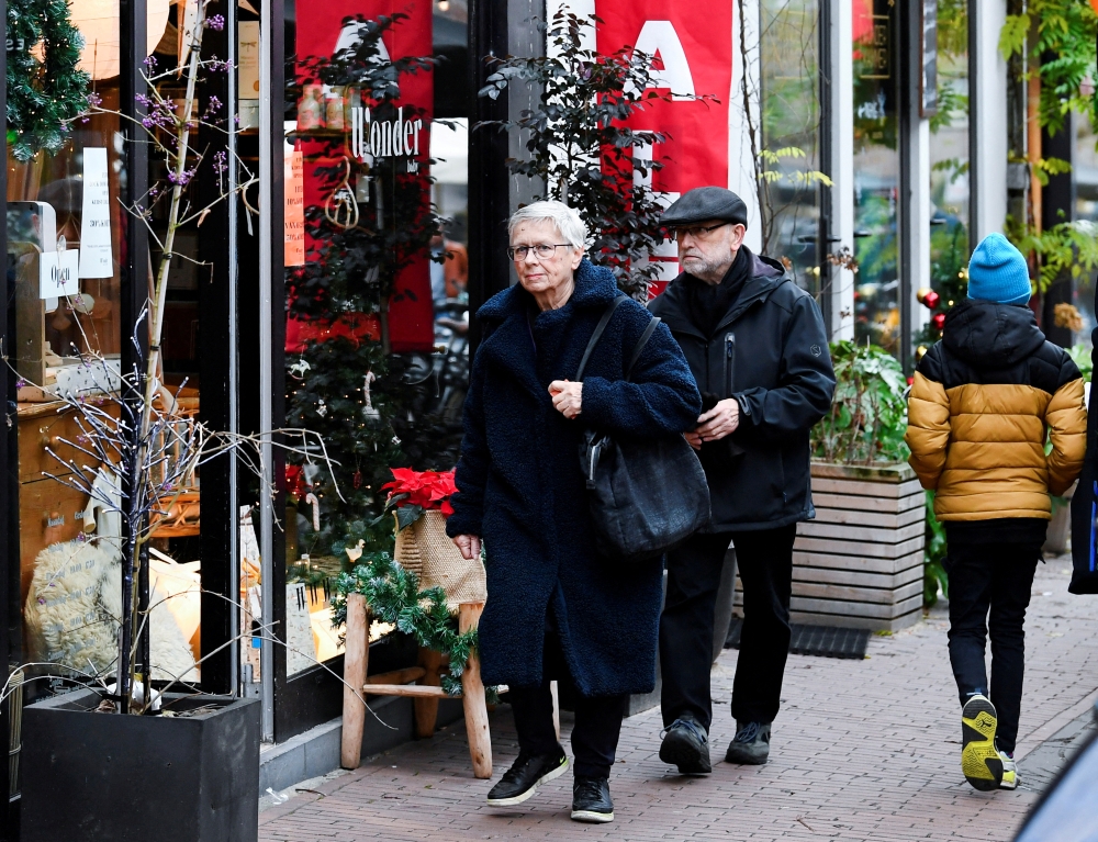 People do their Christmas shopping before the Dutch government's expected announcement of a 