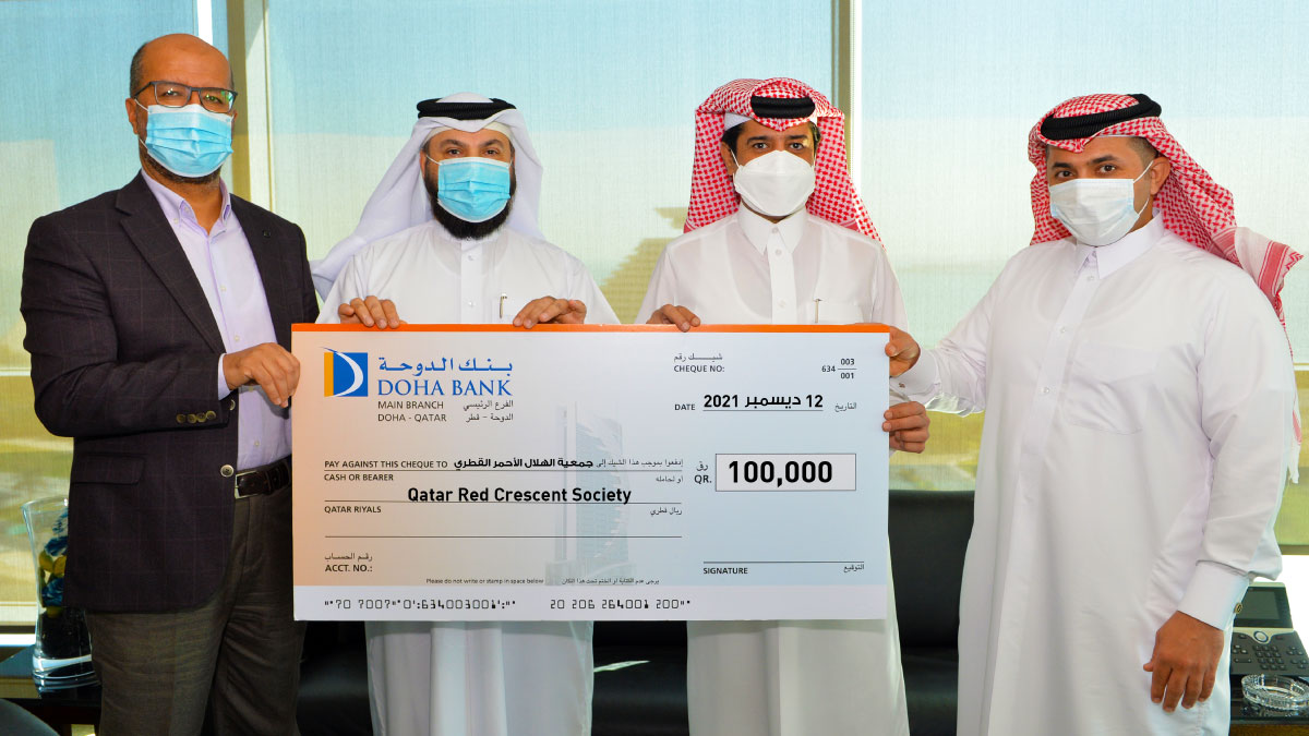 Ahmed Al Hanzab (second right), Head of Administration & Property Department at Doha Bank, presenting the bank’s donation to Qatar Red Crescent officials. 