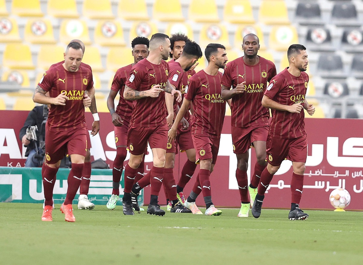 Al Sadd players celebrate.