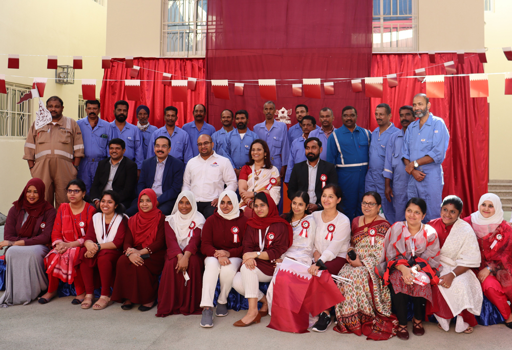School officials, parents and students with workers.