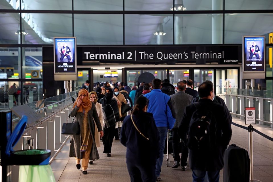 People queue to enter terminal 2, as tighter rules for international travellers start, at Heathrow Airport, amid the spread of the coronavirus disease (COVID-19) pandemic, London, Britain, January 18, 2021. REUTERS/Henry Nicholls/File Photo

