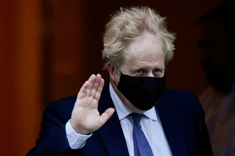 British Prime Minister Boris Johnson gestures as he leaves Downing Street to attend Prime Minister's Questions in Parliament, in London, Britain, January 5, 2022. REUTERS/Toby Melville/File Photo