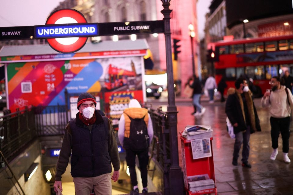 People exit Piccadilly Circus underground station, amid the coronavirus disease (COVID-19) outbreak, in central London, Britain, January 6, 2022. REUTERS/Henry Nicholls

