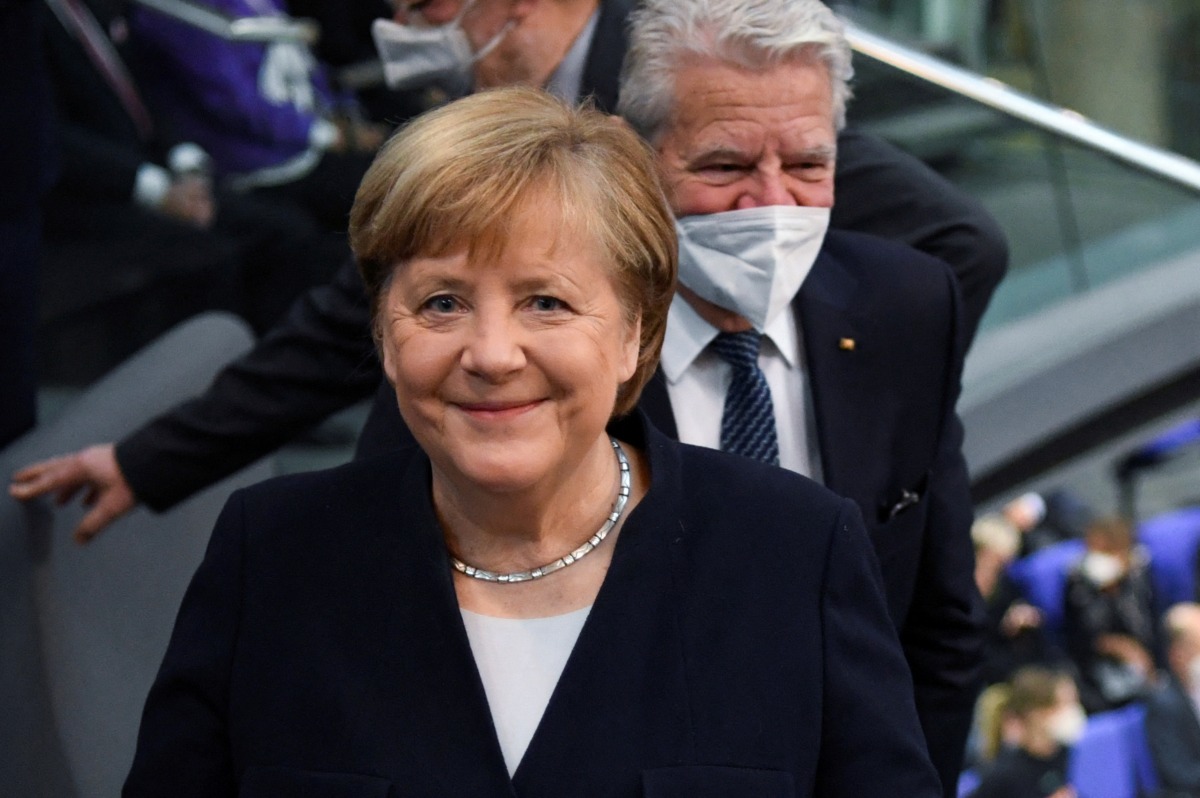 FILE PHOTO: Germany's outgoing Chancellor Angela Merkel arrives for a session of the German lower house of parliament Bundestag to elect a new chancellor, in Berlin, Germany, December 8, 2021. REUTERS/Annegret Hilse/File Photo
